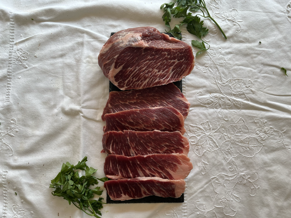 Selection of beef cuts on linen